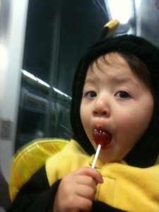 Peace and quiet on the F train, thanks to a lollipop.